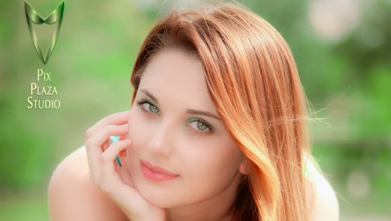 Ginger hair girl outdoors sitting on fence and leaning forward